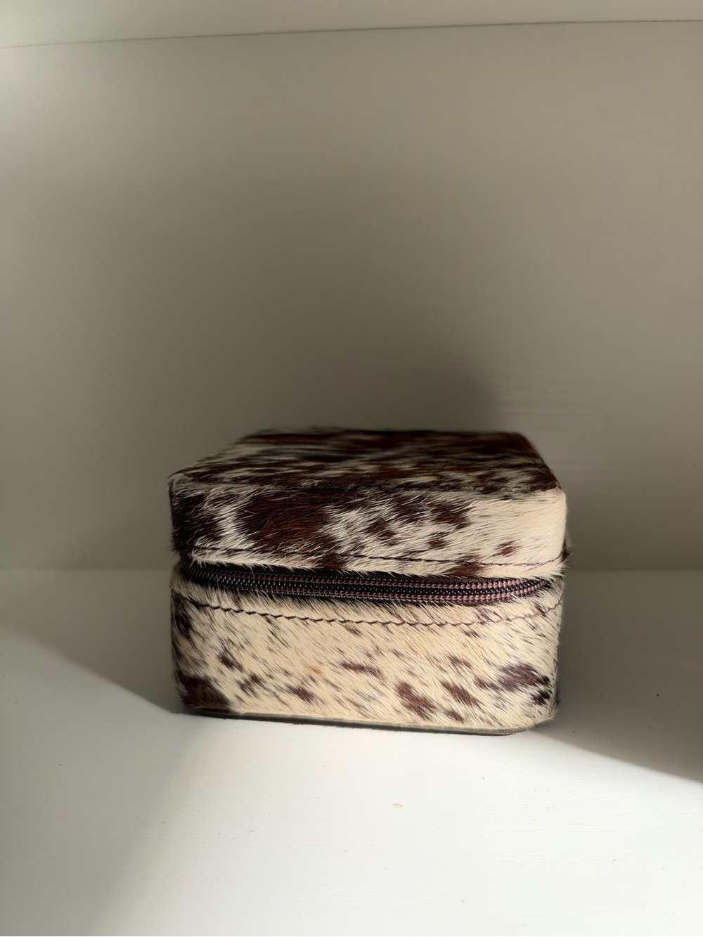 travel jewelry case in brown & white real cowhide print